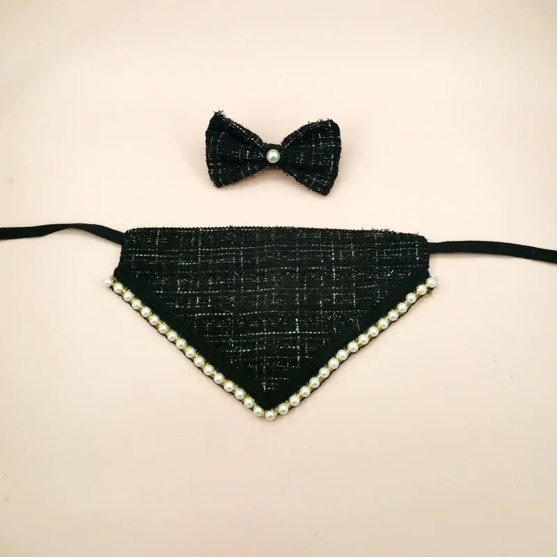 Black textured bandana with pearl trim and matching bow tie on a beige background