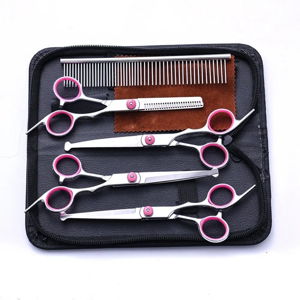 Set of pet grooming scissors and a comb in a black case on a white background