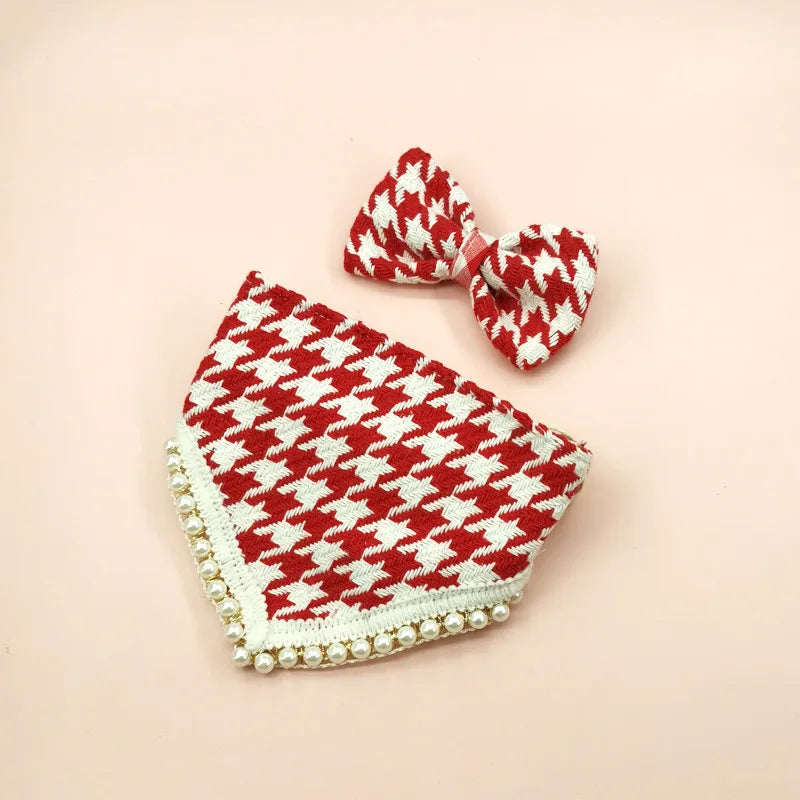 Red and white houndstooth patterned baby outfit with matching hat on a beige background