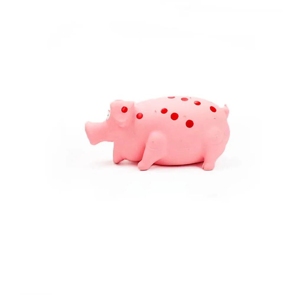 Pink pig-shaped object with holes on a white background