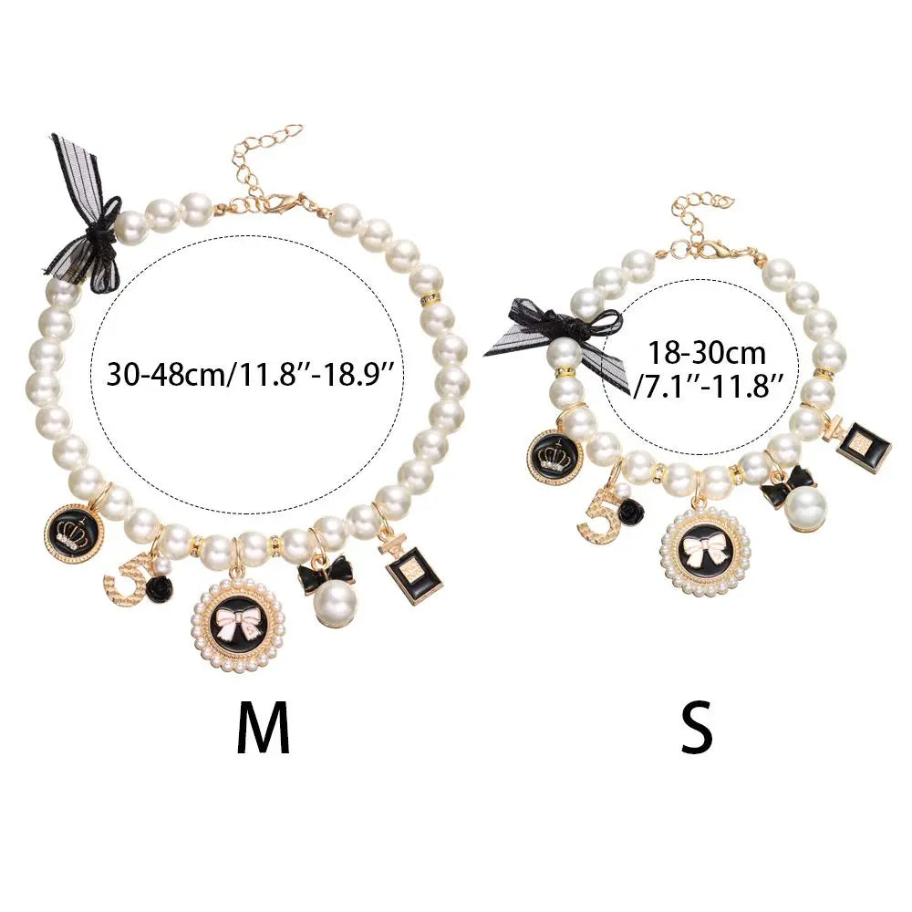 Two pearl necklaces with charms and measurements on a white background