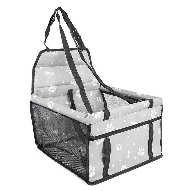 Pet car seat with paw and bone pattern on a white background