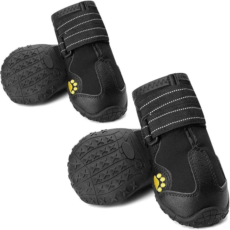 Black dog boots with yellow paw prints on a white background