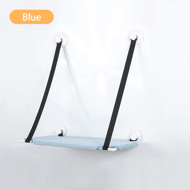 Blue lounger with black support traps suctioned to white wall