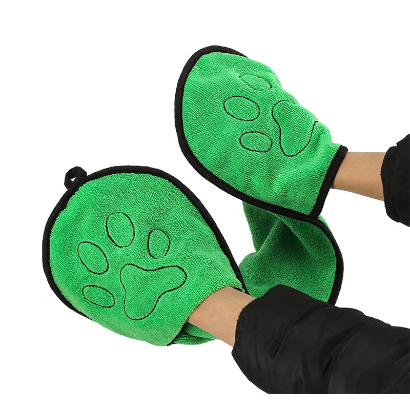 Green grooming towles with paw prints on a white background