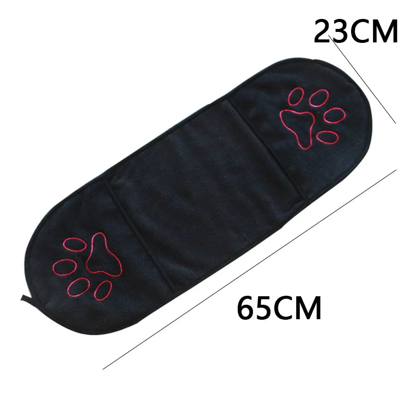 Black towel with red paw prints and measurements on a white background