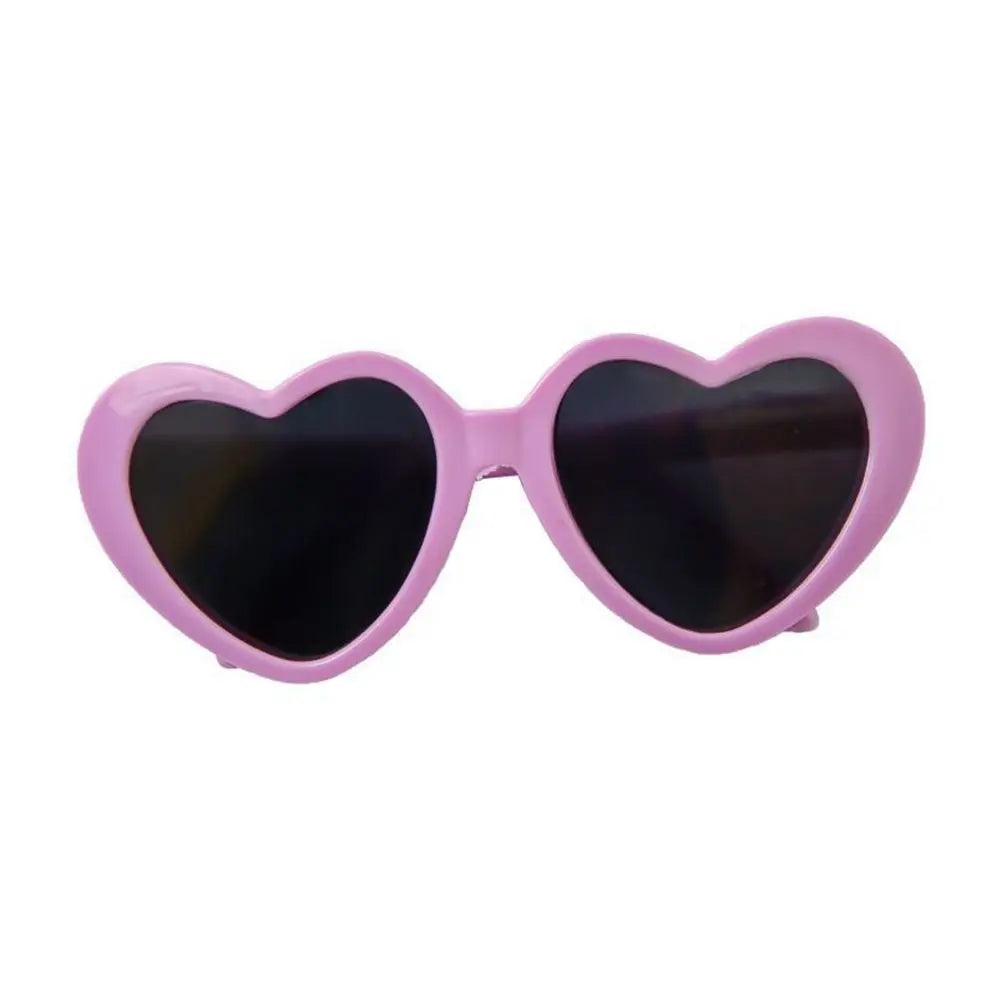 Heart-shaped sunglasses with pink frame on a white background