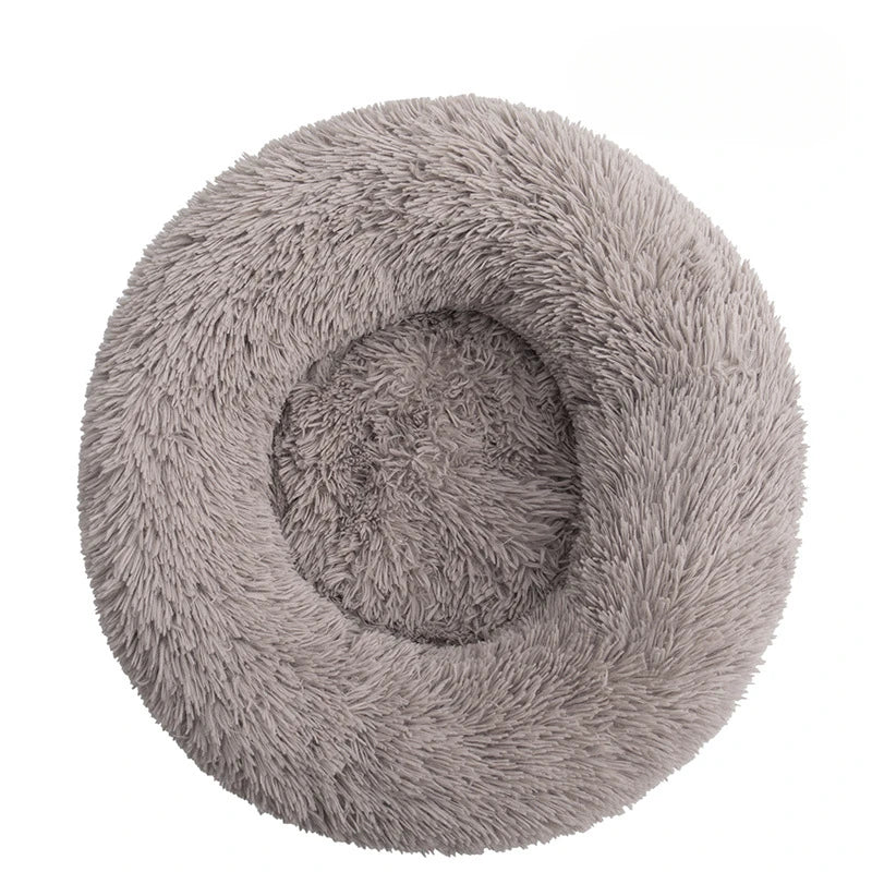 Fluffy gray pet bed on a white background