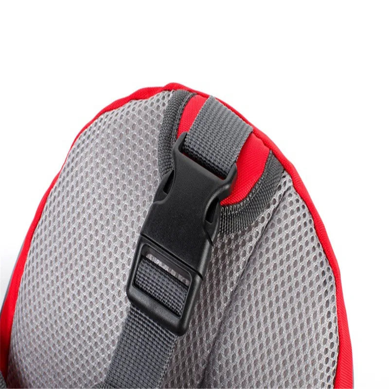 Close-up of a red and gray backpack shoulder strap with a black buckle on a white background