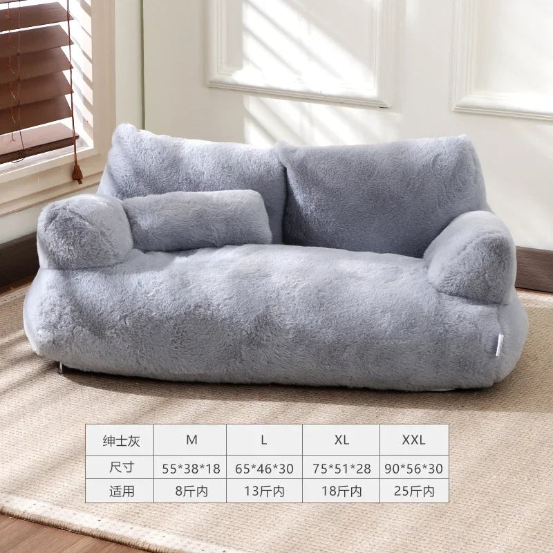 Gray pet bed on a carpeted floor with size chart below
