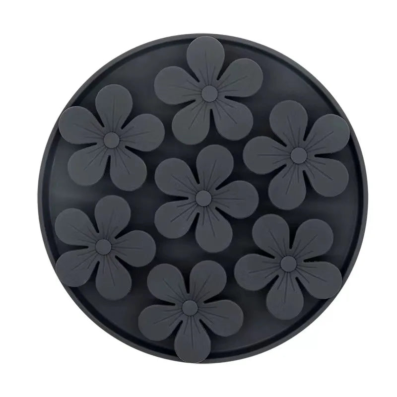 Black silicone flower-shaped mold on a white background