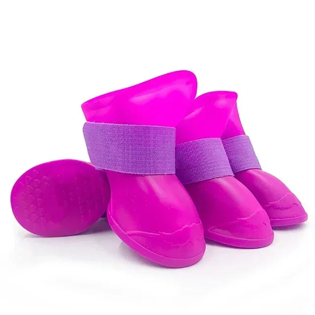 Purple rain boots with purple straps on a white background