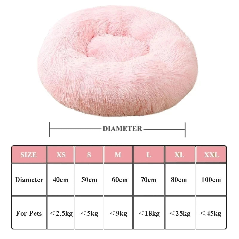 Pink donut pet bed with size chart on a white background