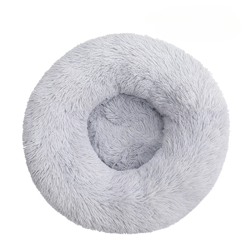 Fluffy gray donut-shaped pet bed on a white background