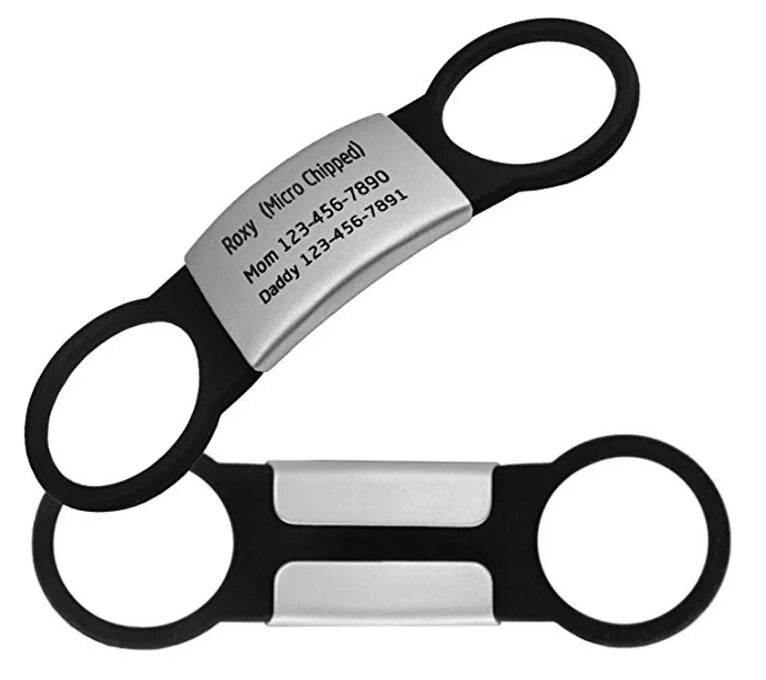 Pair of black and silver key chains with engraved text on a white background
