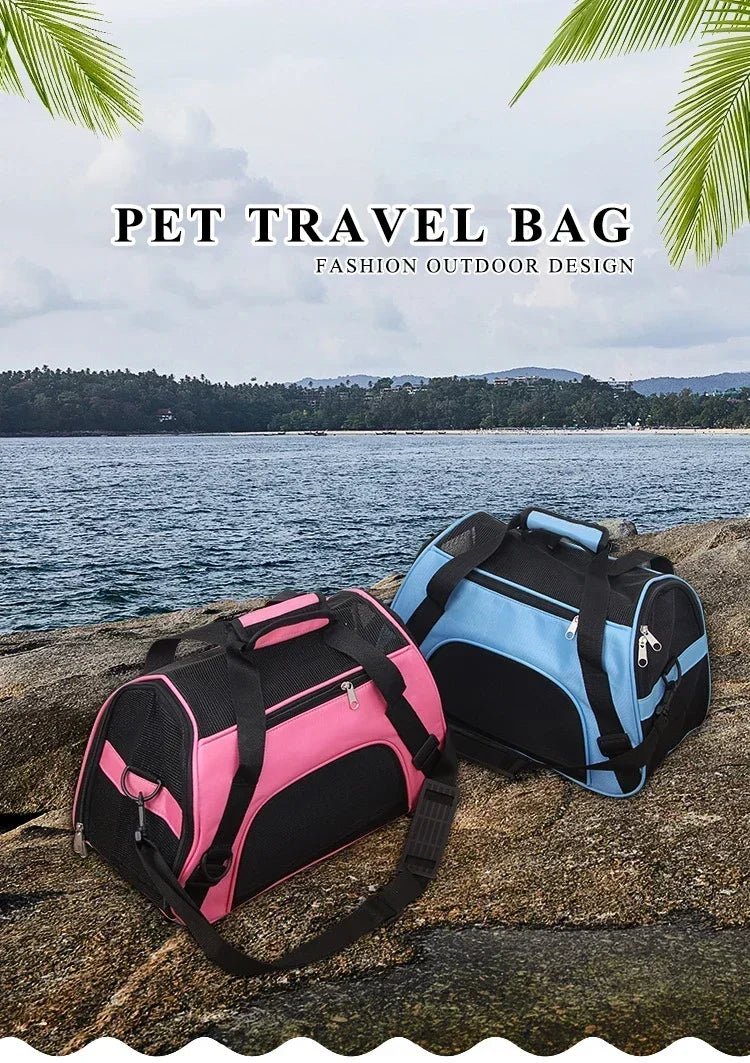 Two pet travel bags, one pink and one blue, on a rock with a scenic background.