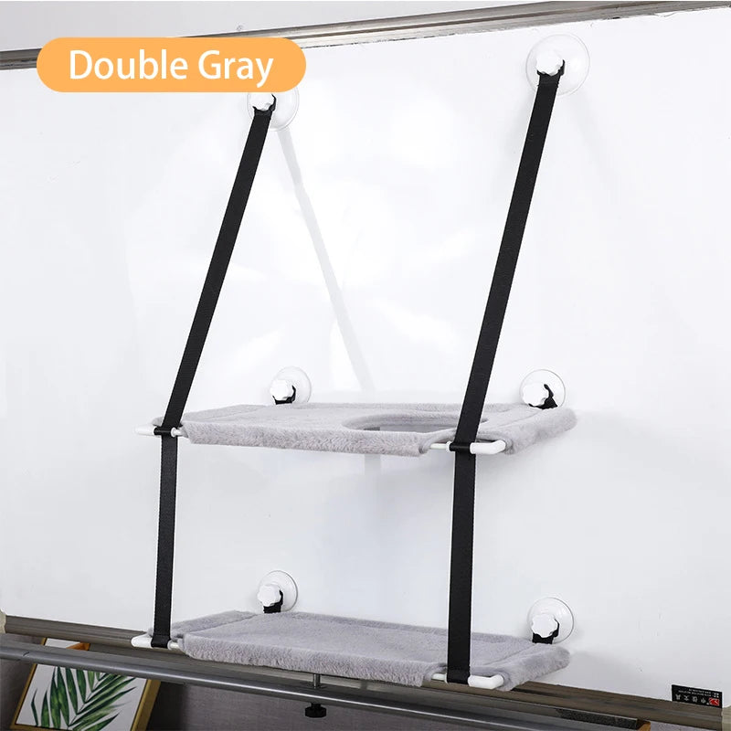 Two-tiered pet stand with gray platforms and black metal legs on a white background.