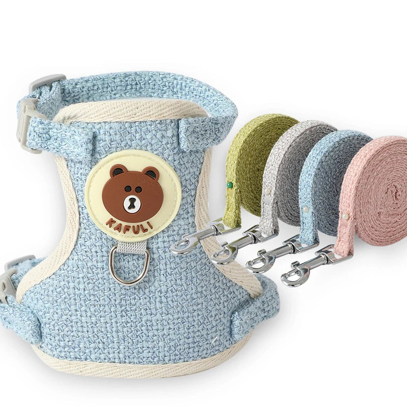 Pet harness with bear emblem and attached leashes on a white background