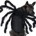 Dog wearing a spider costume with long black legs on a white background