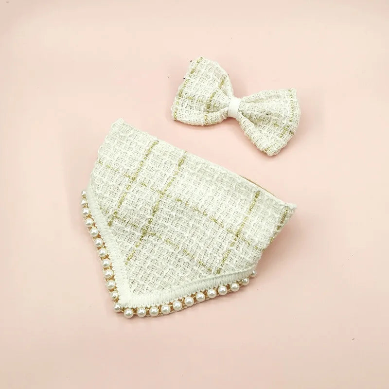 Light green textured headband with pearl embellishments on a pink background