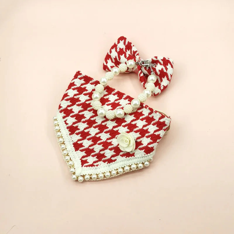 Red and white houndstooth patterned headband and matching hair tie on a beige background