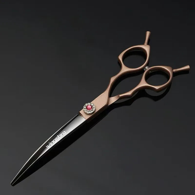 Hairdressing scissors with a decorative handle on a black background