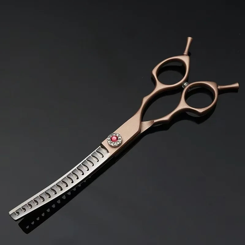 Hair cutting scissors with a decorative handle on a black background