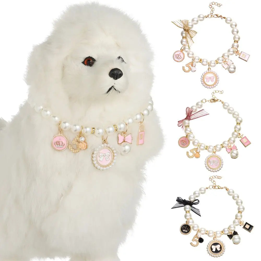 White dog wearing a pearl necklace with charms, surrounded by additional pearl necklaces with various charms on a white background.