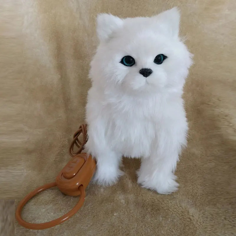White fluffy toy cat with a brown remote ring on a beige background