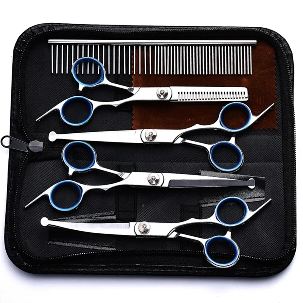 Set of hair cutting shears and combs in a black case on a white background