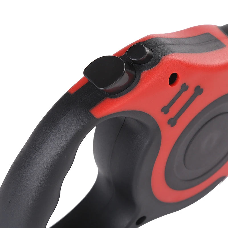 Close-up of a red and black retractable dog leash on a white background