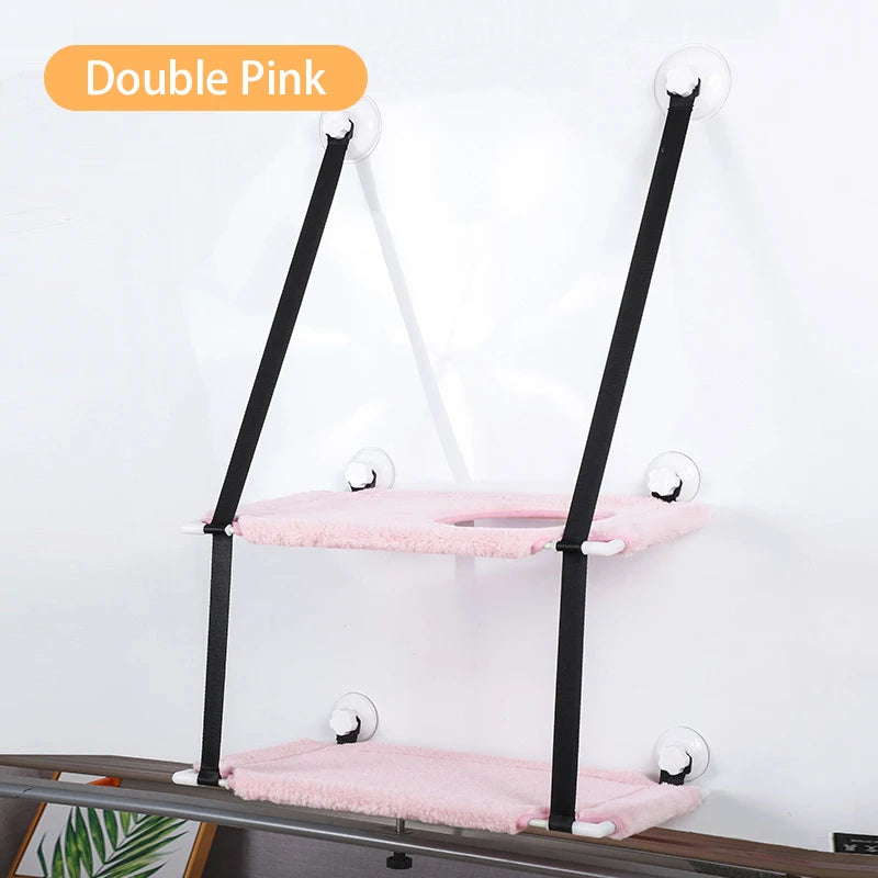 two tier pink loungers suction cupped to white wall with black support straps