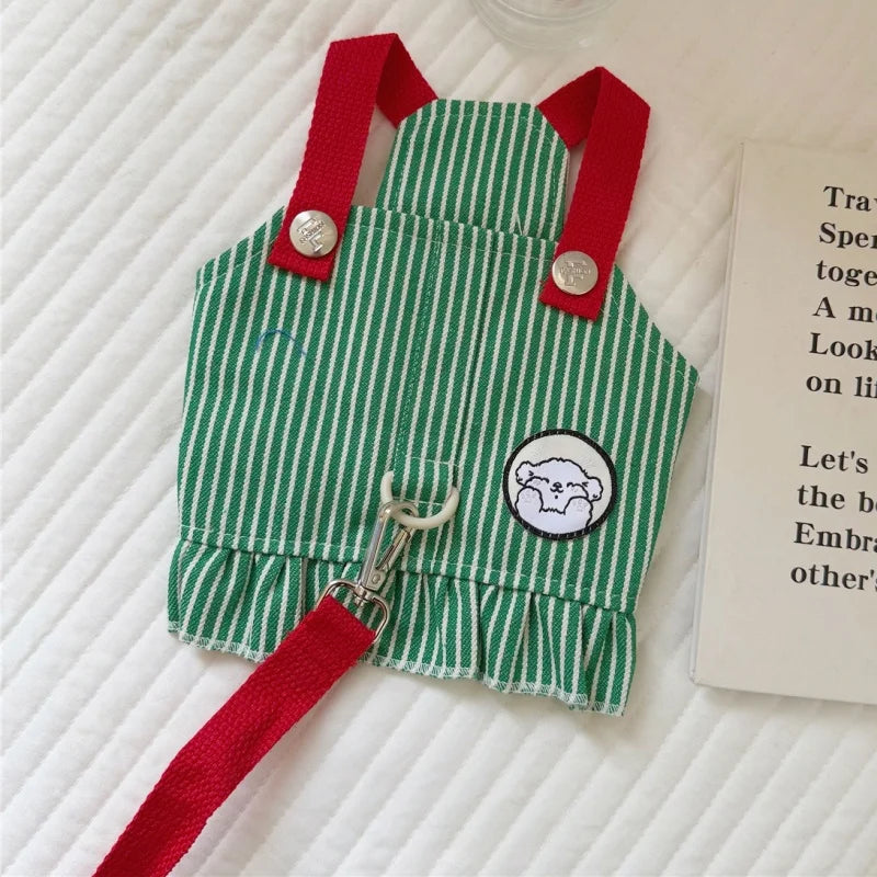 Green and red striped apron with a patch on a textured surface