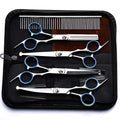 Set of hair cutting shears and combs in a black case on a white background