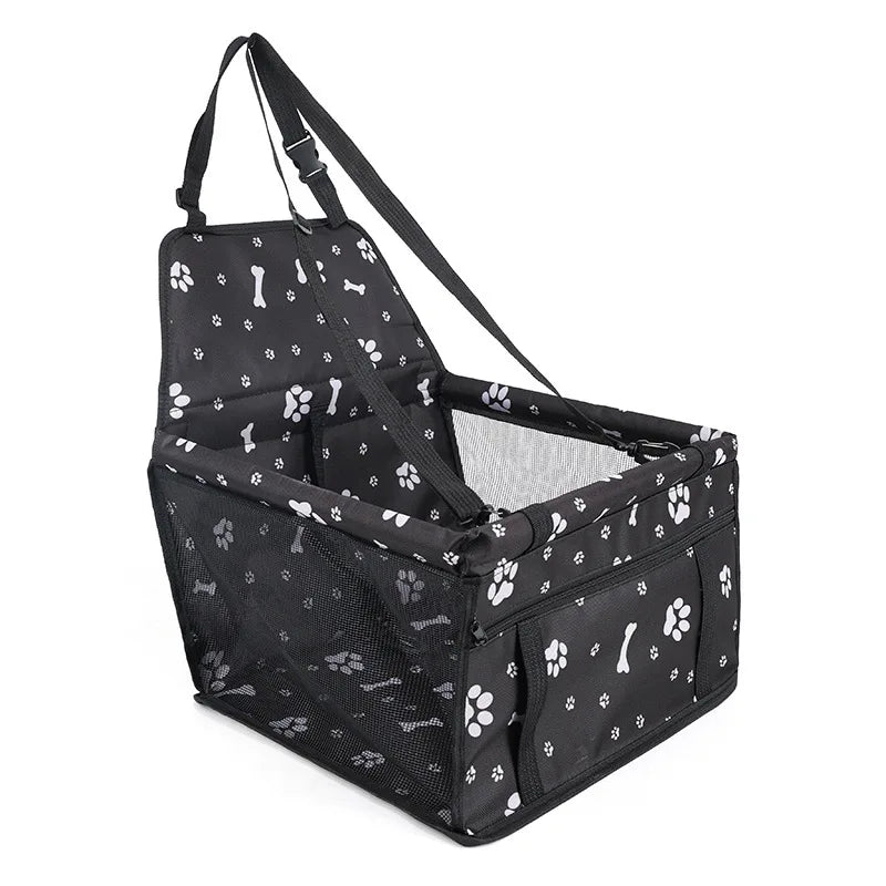 Black pet carrier with paw print pattern on a white background