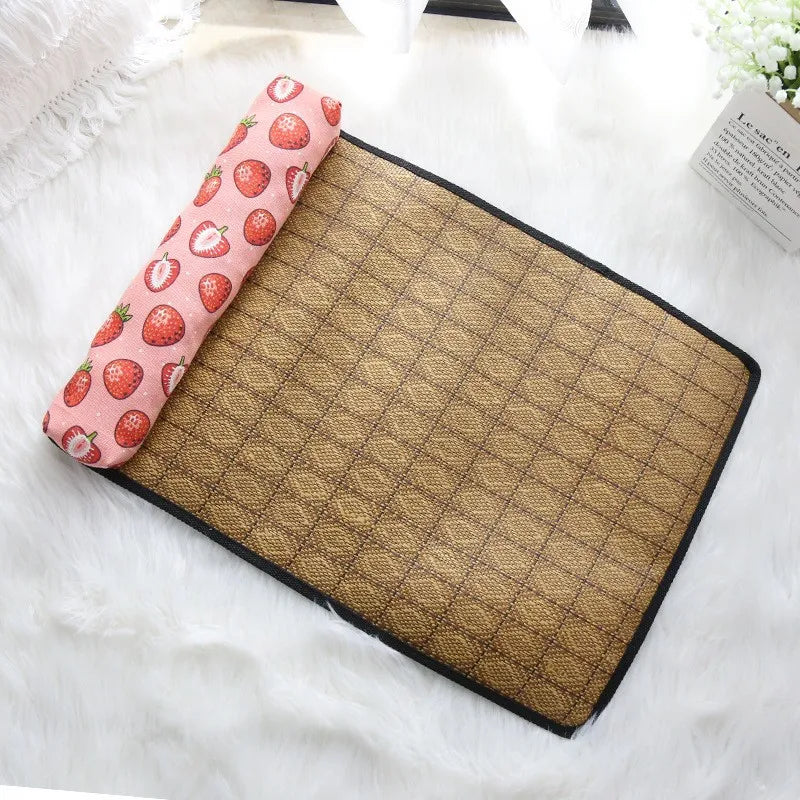 Brown textured mat with a pillow featuring strawberry pattern on a white surface.