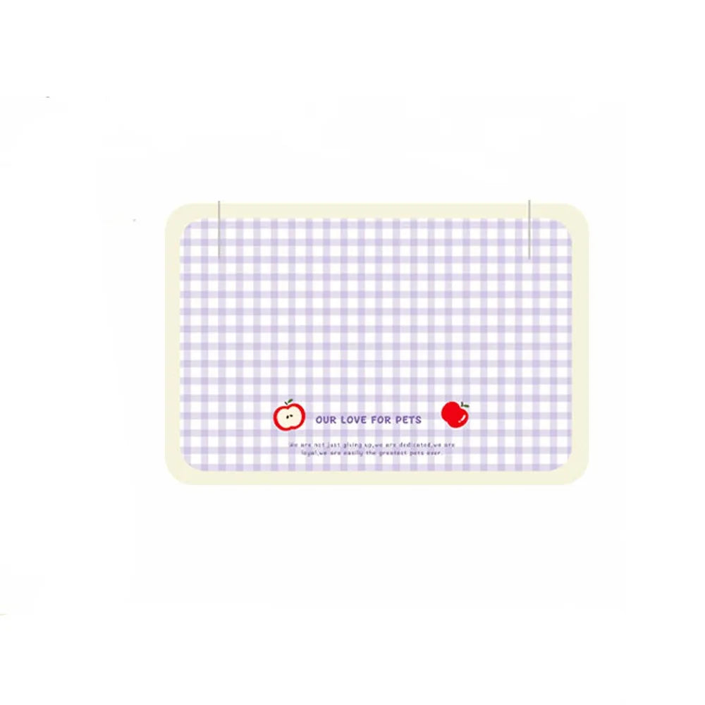 Rectangular pet mat with blue checkered pattern and red apple design on a white background