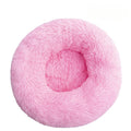 Pink fluffy donut pet bed on a white background