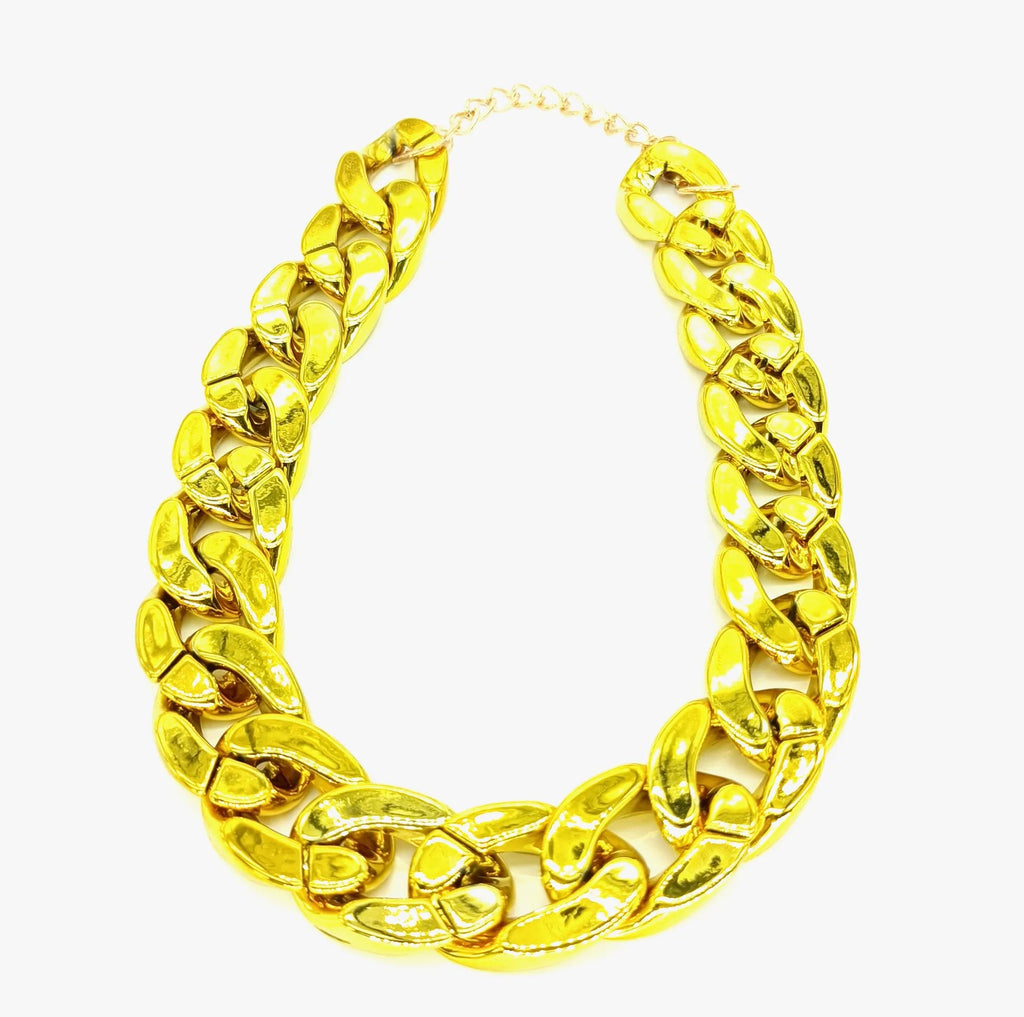 Gold chain necklace on a white background