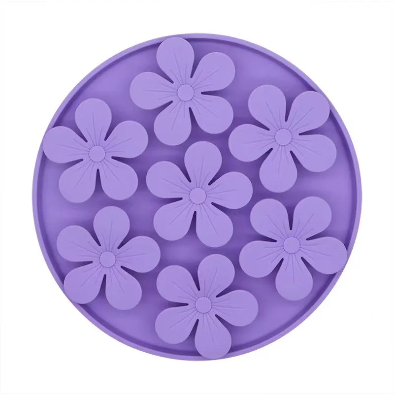 Purple silicone mold with flower shapes on a white background